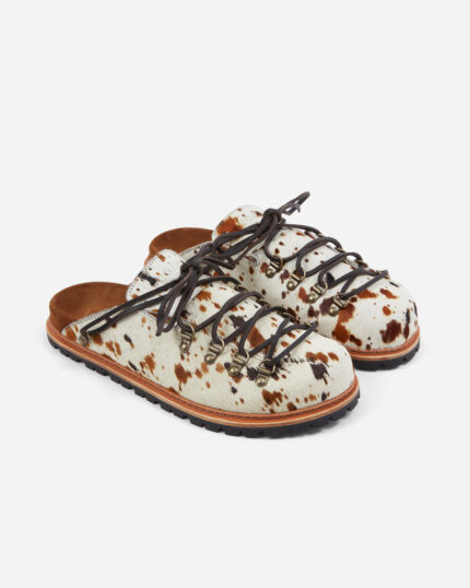 FUGAZI Tibet Mule Spotted Pony – white pony hair lace up mule with brown and black spots, leather laces, brown suede footbed and lug sole